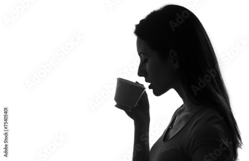 profile of woman holding drinking cup of coffee tea black white