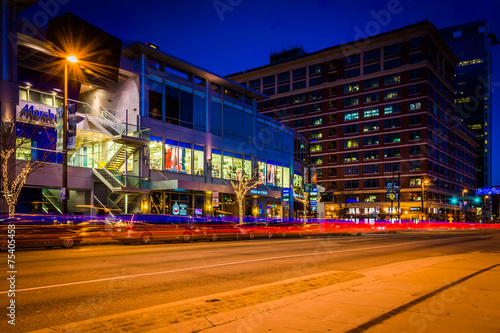 Traffic and buildings on Pratt Street at night, in downtown Balt © jonbilous