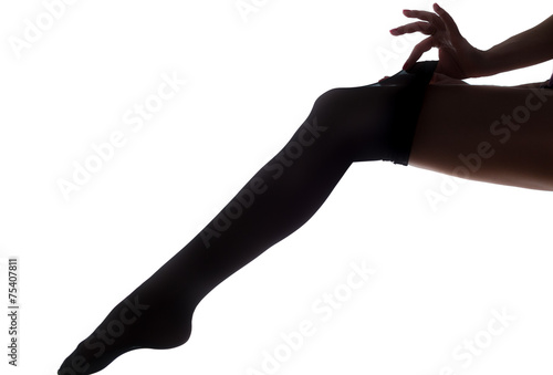 lady puts on stockings