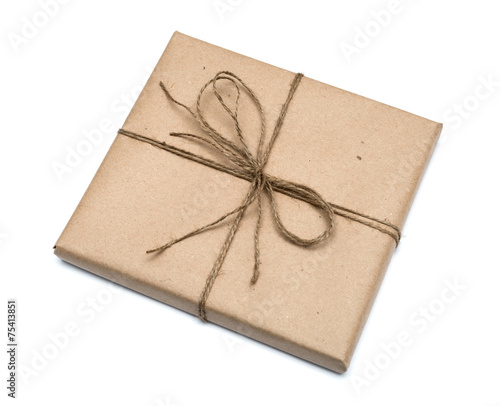 parcel wrapped with brown kraft paper isolated on white backgrou