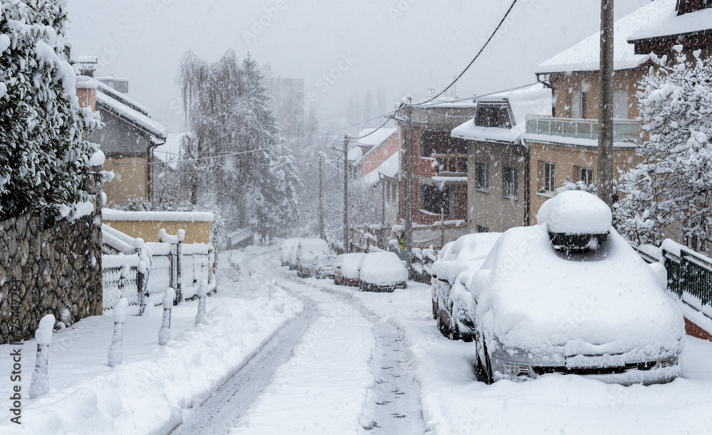 Cars and roads covered with snow