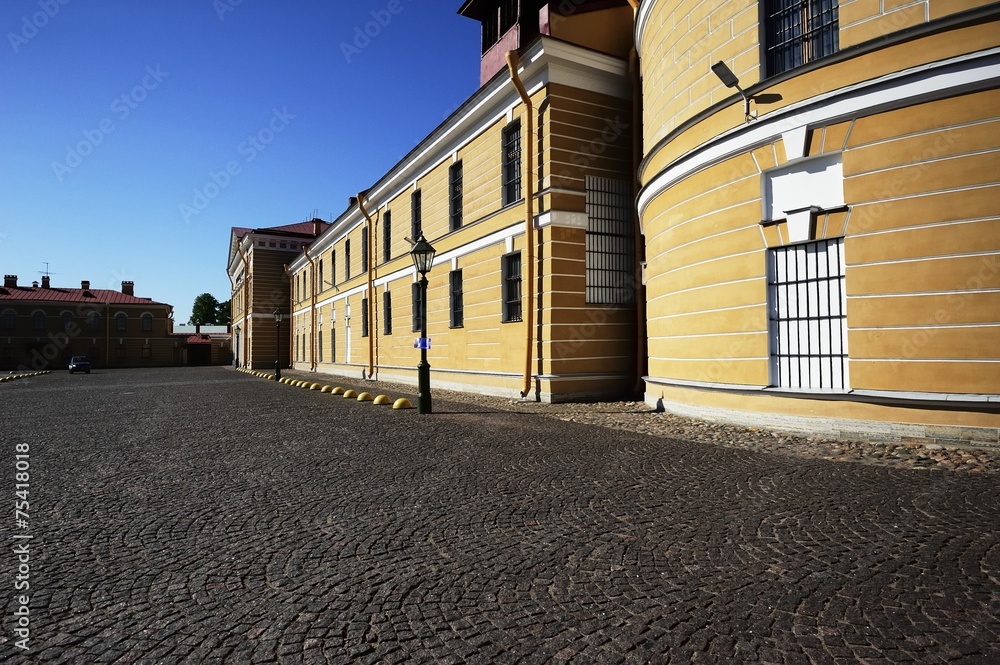 Cobbled Street and Yellow Building