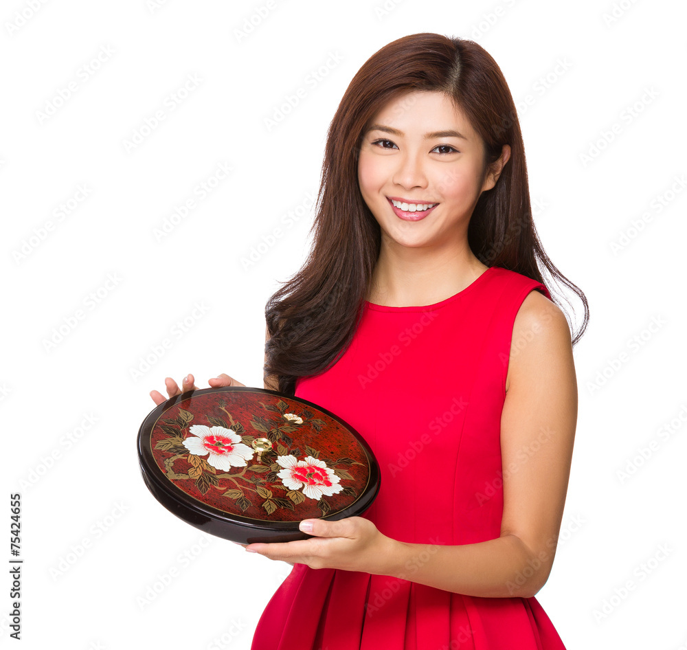 Asian woman hold with lunar traditional snack tray Asian woman hold with lunar traditional snack tray