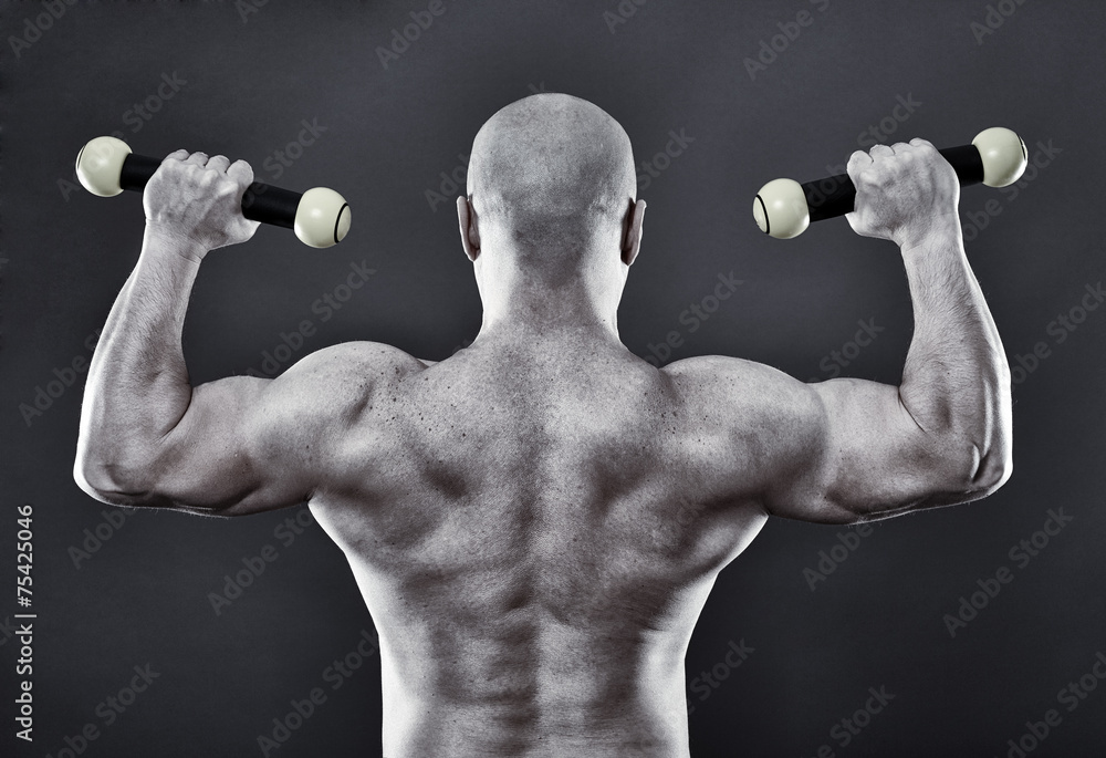 Strong man with minuscule dumbbells Strong man with minuscule dumbbells