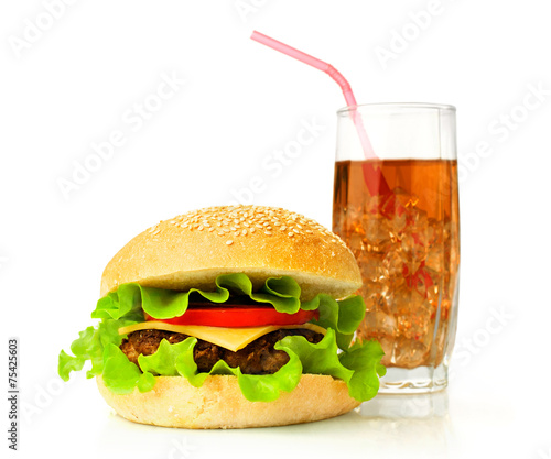 Big hamburger and cola with ice cubes