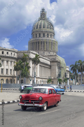 Red american car  in front of Capitolio, Havana, Cuba