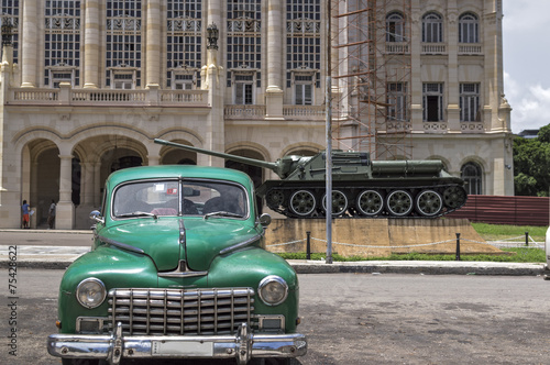 tiOld american car in front of the Presidenal Palace in Havana