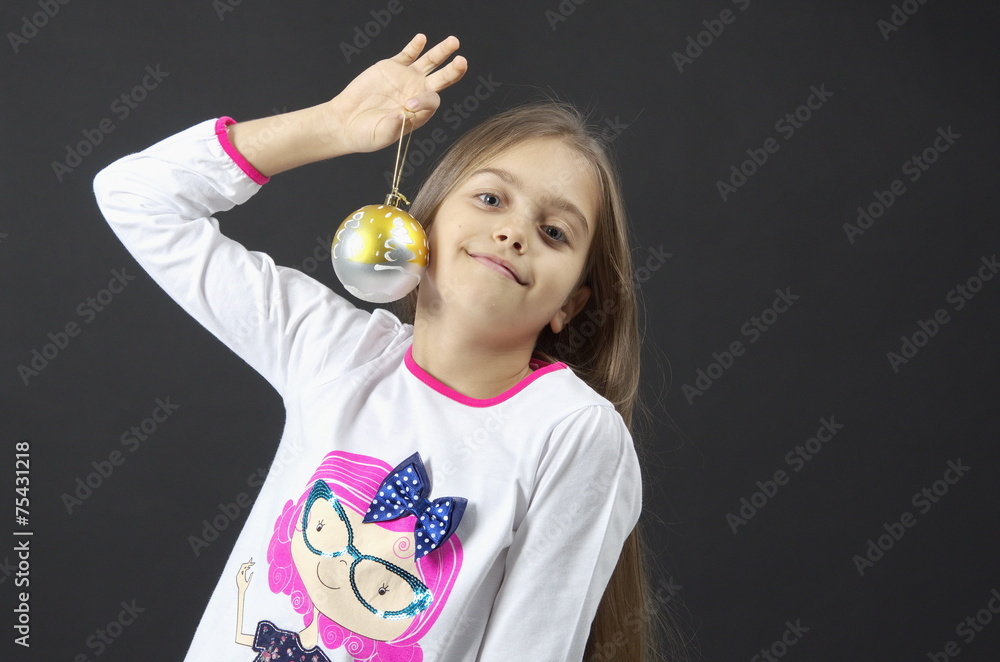 Christmas girl with a ball on a black background Christmas girl with a ball on a black background