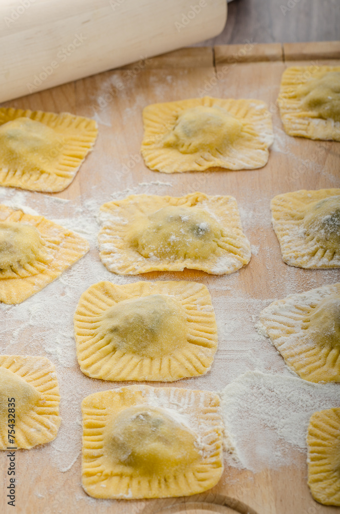 Homemade ravioli stuffed with spinach and ricotta Homemade ravioli stuffed with spinach and ricotta