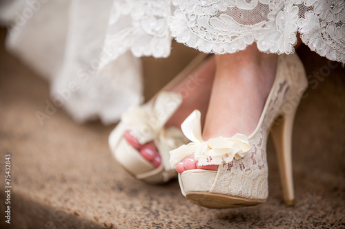 Beautiful white creamy lacy wedding shoes