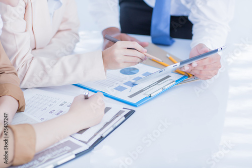 Business people discussing the charts and graphs showing the res