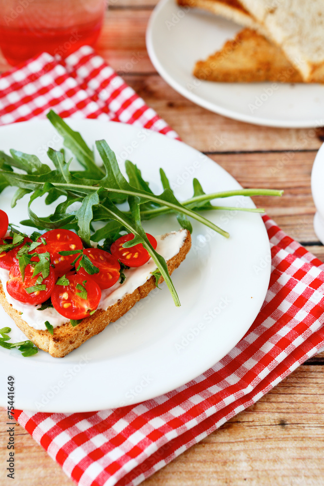 Delicious bruschetta with tomato and cheese on a plate