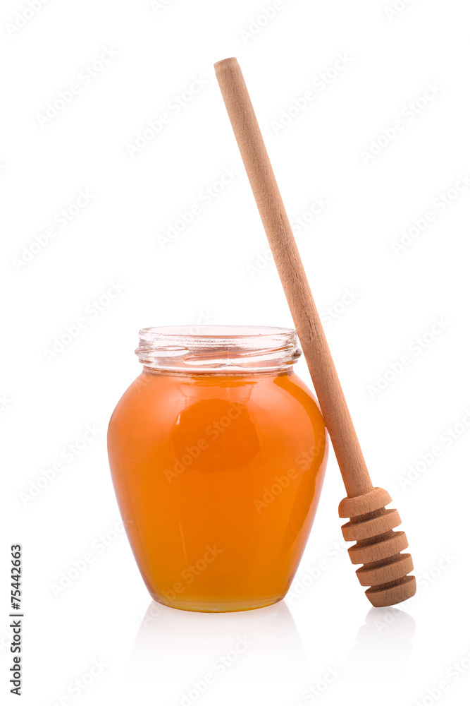 Honey jar and wooden spoon Honey jar and wooden spoon