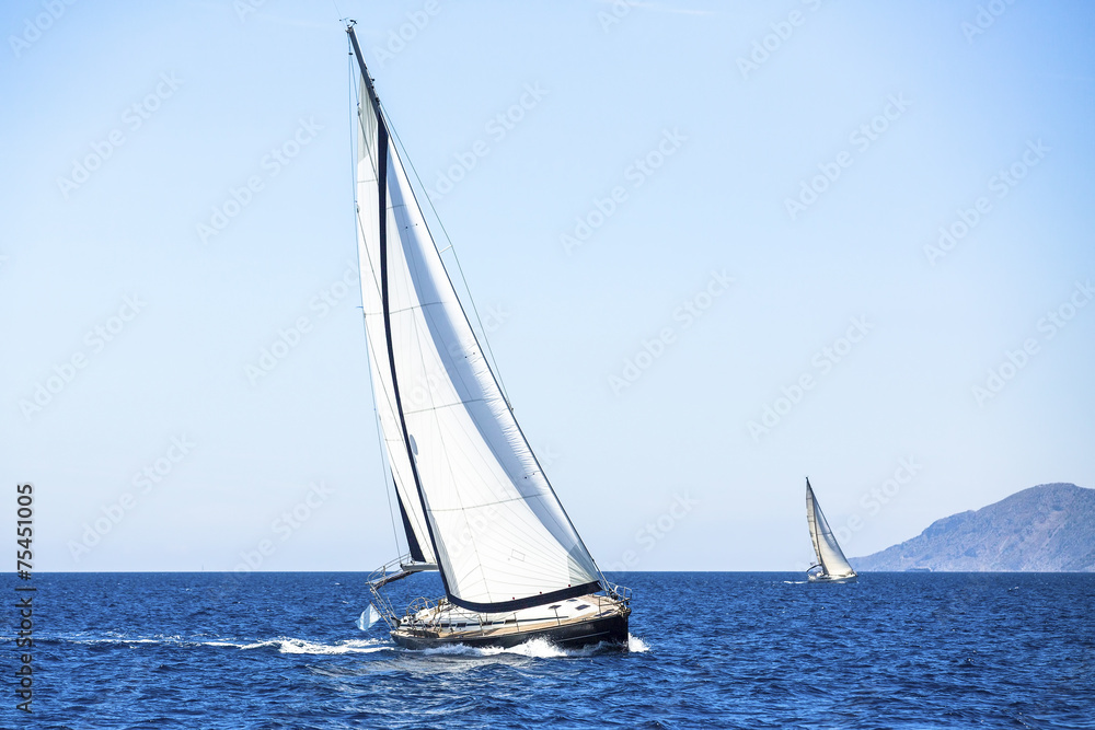Sail yachts in regatta in open the Sea. Luxury yachts.