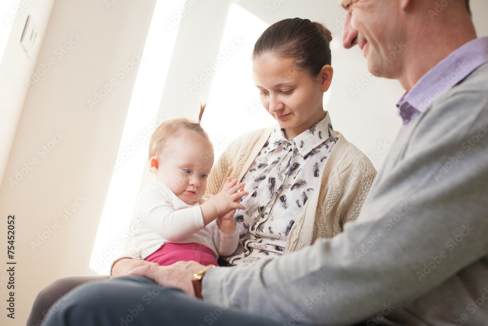 Three generations. Grandfather, young mother and baby Three generations. Grandfather, young mother and baby