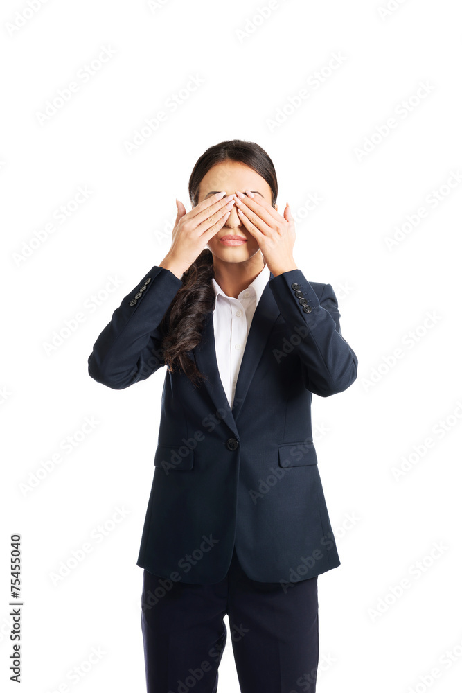 Full length young businesswoman covering eyes with hands Full length young businesswoman covering eyes with hands
