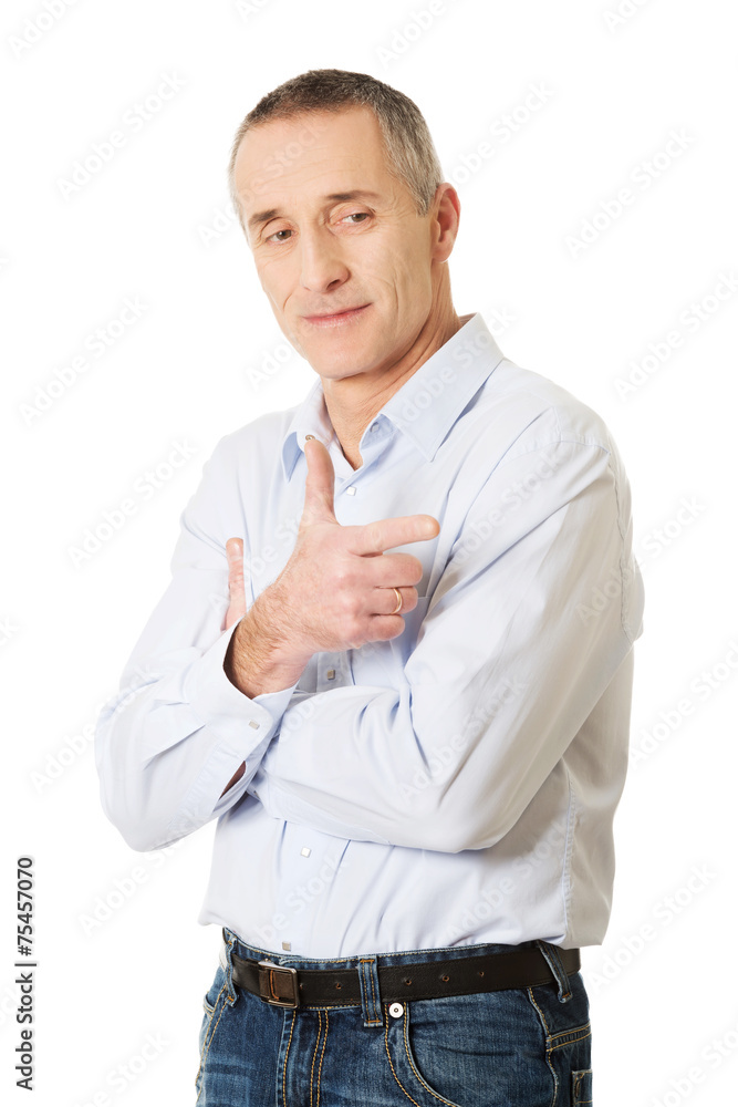Portrait of happy handsome man pointing at you Portrait of happy handsome man pointing at you