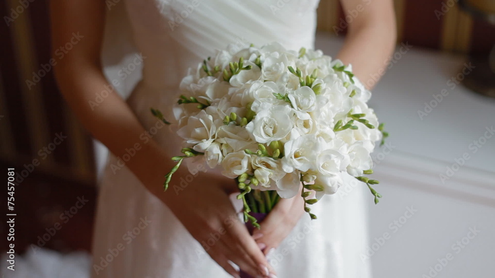 Bride held wedding bouquet in her arms Bride held wedding bouquet in her arms