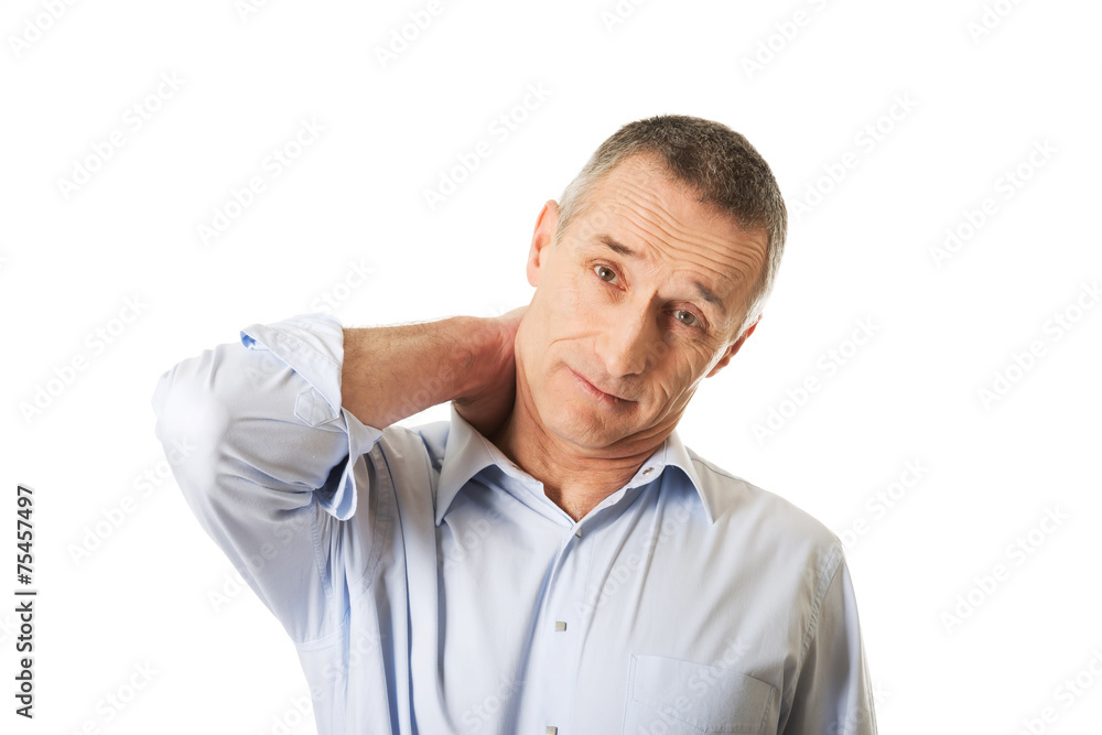Portrait of a mature man suffering from neck pain Portrait of a mature man suffering from neck pain