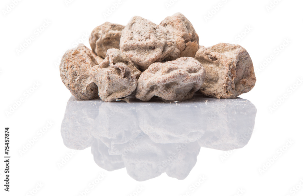 Salted tamarind fruit over white background Salted tamarind fruit over white background
