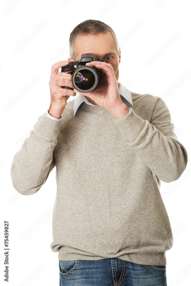 Mature man with photo camera Mature man with photo camera