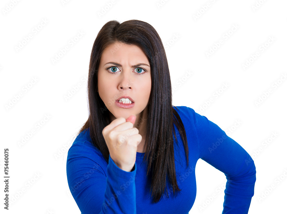 Portrait angry bitter, displeased young woman showing you fist Portrait angry bitter, displeased young woman showing you fist