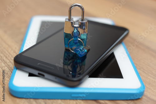 Padlock on smart phone and tablet computer. Safety & security on