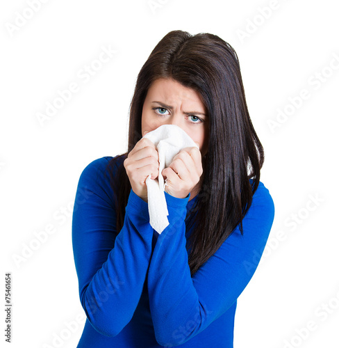 Miserable, sick woman with allergy, cold, blowing her nouse