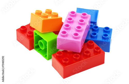 Toy colorful plastic blocks isolated on white background