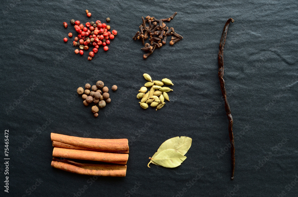 Mix of spices on a stone background Mix of spices on a stone background