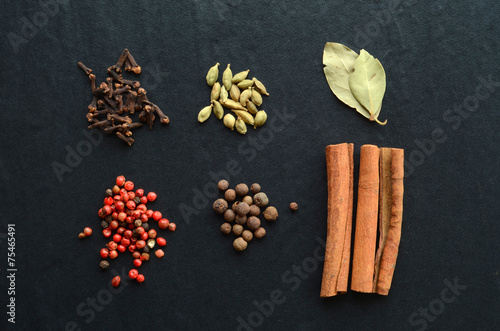 Mix of spices on a stone background