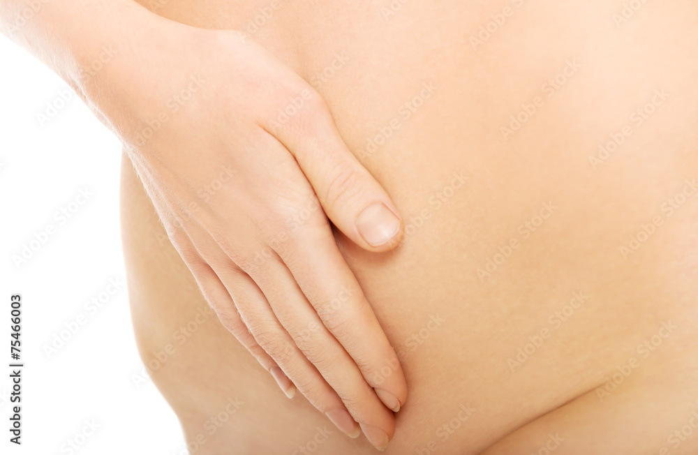 Close up on woman massaging slim belly