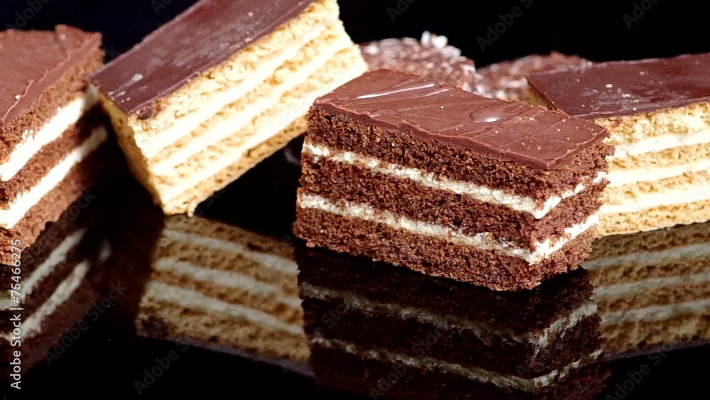 Sweet desserts on a black background with reflection Sweet desserts on a black background with reflection