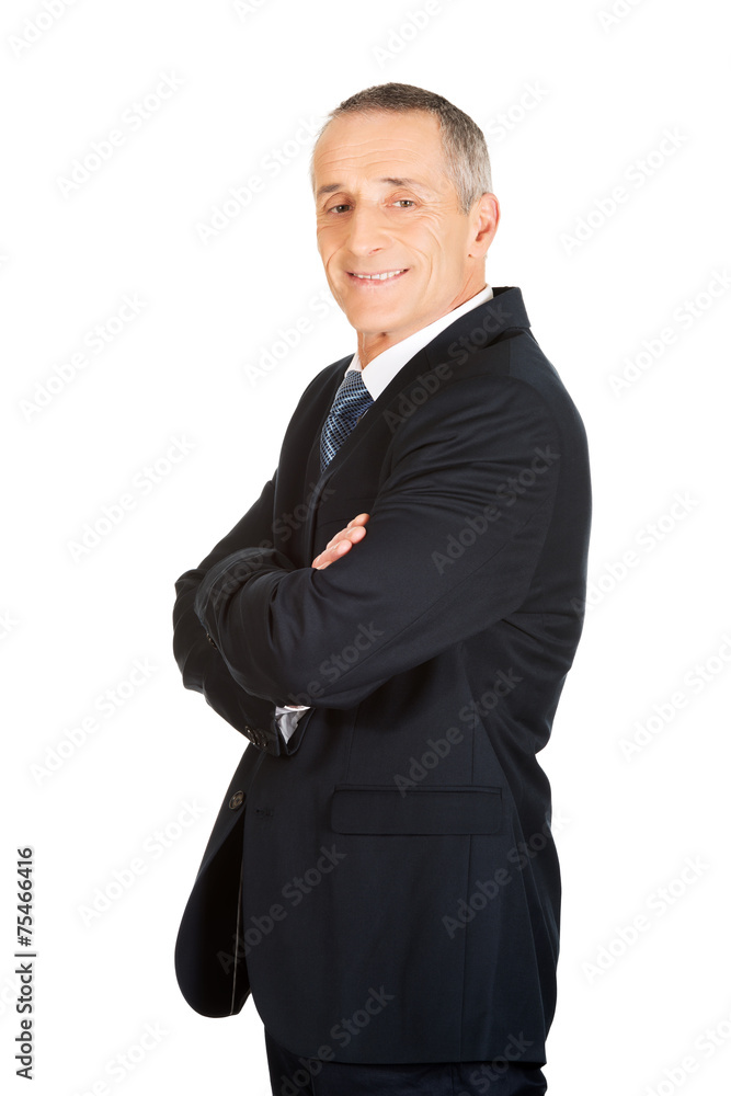 Side view of businessman with folded arms Side view of businessman with folded arms