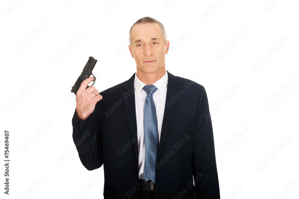 Portrait of serious mafia agent with handgun Portrait of serious mafia agent with handgun