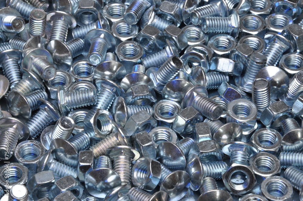 Nuts and bolts as industrial background Nuts and bolts as industrial background