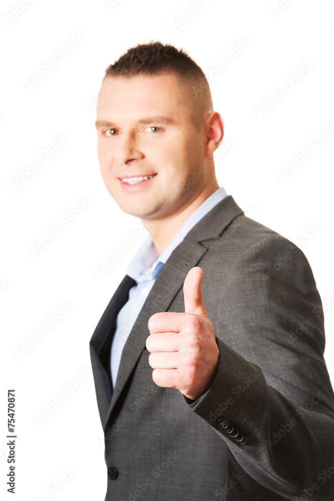 Young businessman gesturing ok sign
