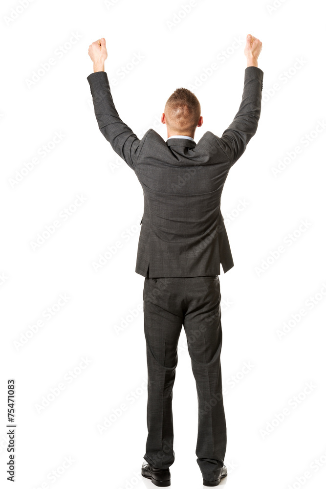 Young businessman celebrating his business success Young businessman celebrating his business success