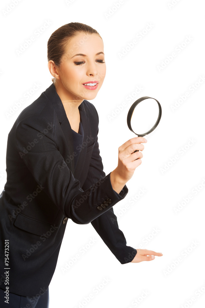 Smiling businesswoman with magnifying glass Smiling businesswoman with magnifying glass