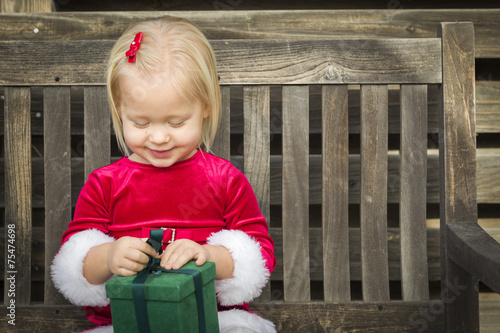 Adorable Little Girl Unwrap...