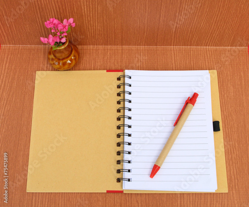 notebook and vase