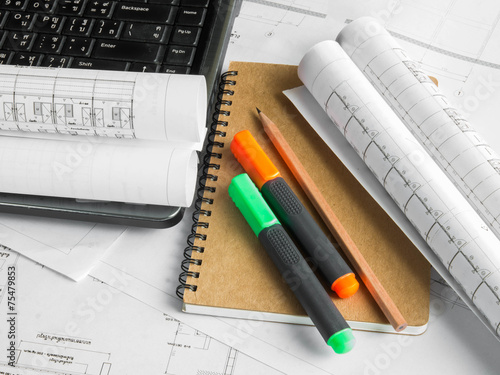 Architectural blueprint of office building with a pencil ,notebo