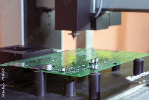 Electronic printed circuit Board on the table of the robot manip