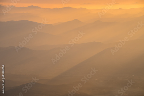 Mountain layer with the golden sunlight