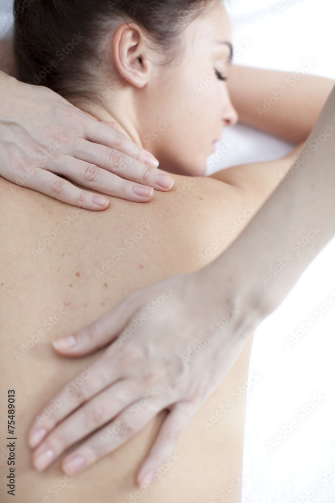 Young woman getting a massage in a spa Young woman getting a massage in a spa