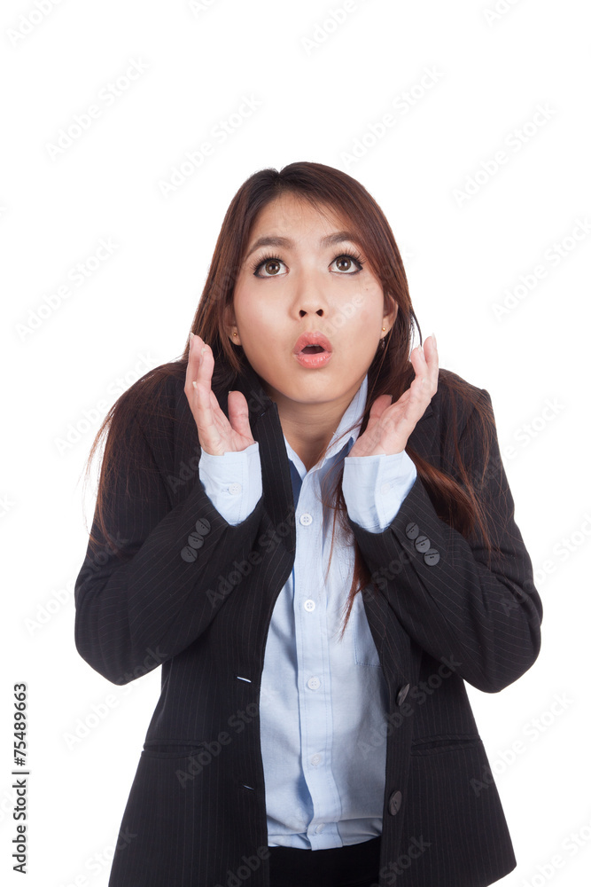 Young Asian businesswoman shocked and look up Young Asian businesswoman shocked and look up