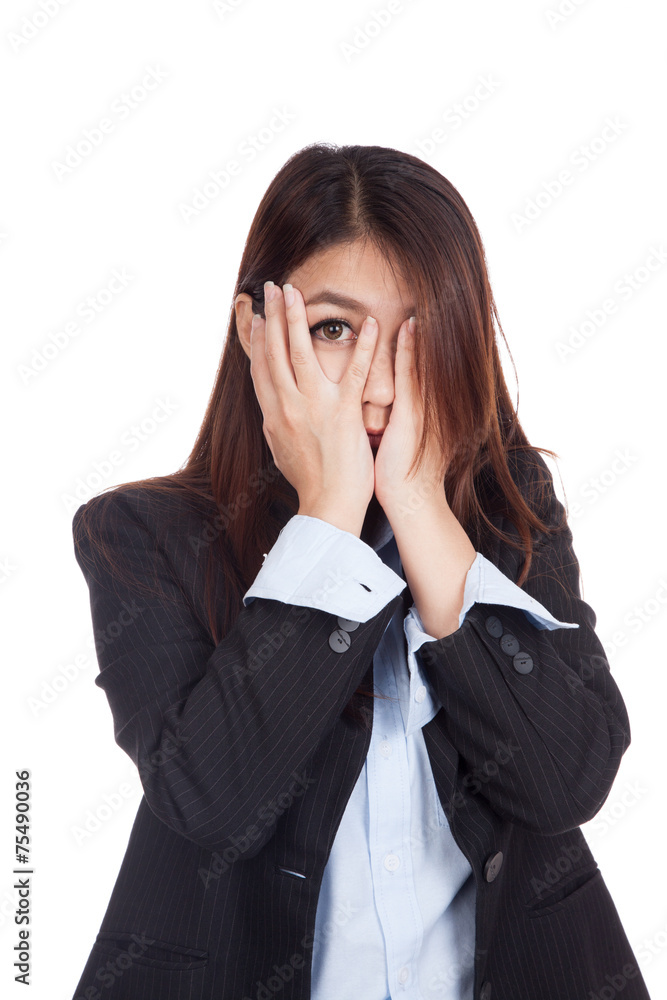 Young Asian businesswoman peeking though her fingers Young Asian businesswoman peeking though her fingers