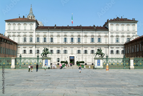 People walking in front of the Royal palace in Turin