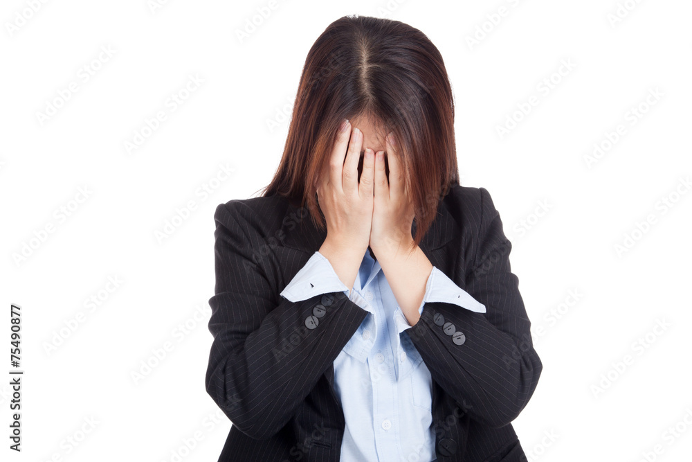 Sad young Asian businesswoman cry with palm to face Sad young Asian businesswoman cry with palm to face