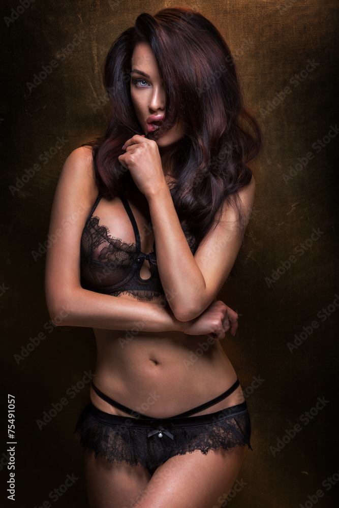 Sensual brunette woman posing in lingerie.